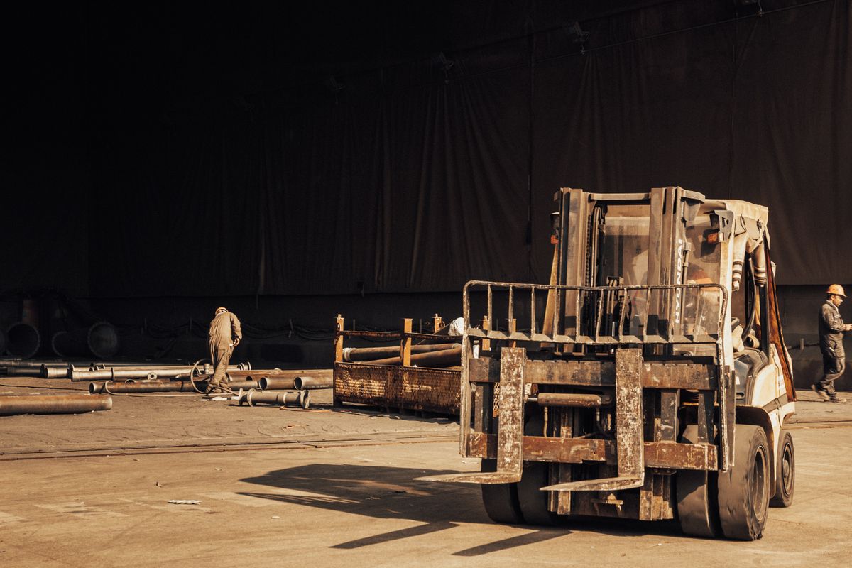 Forklift moving pallets